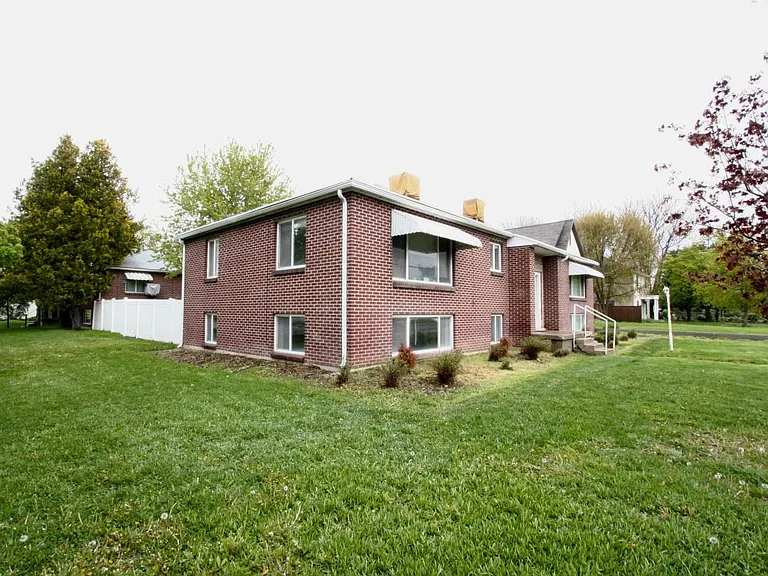 Property has a large grass front yard