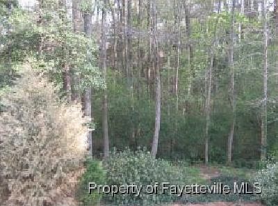 FENCED BACK YARD WITH STREAM