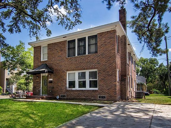 Unit 1 - Living room windows. Unit 2 - Parking and Entry (upstairs unit)