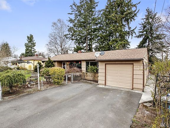 The one car garage features loft storage with a pull down ladder.