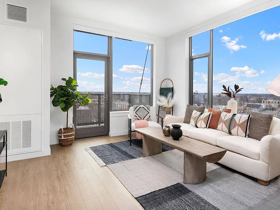Floor-to-ceiling windows and a private balcony bring Oak Park's skyline right into your living room at Eleven33 a bright, modern retreat made for unwinding.