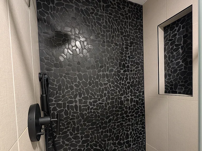 Primary bedroom - ensuite bathroom with tiled shower.