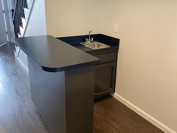 Wet bar with additional storage, perfect for entertaining guests.