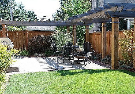 Backyard featuring a large Pergola surrounding the patio and outdoor speakers