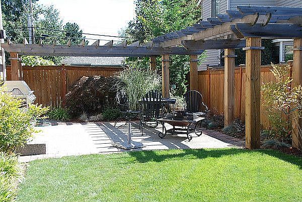 Backyard featuring a large Pergola surrounding the patio and outdoor speakers