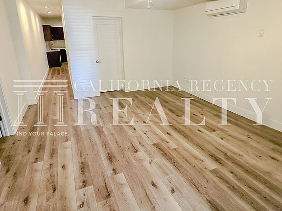Spacious living area with updated finishes and flooring.