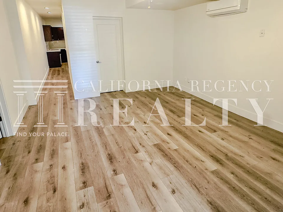 Spacious living area with updated finishes and flooring.