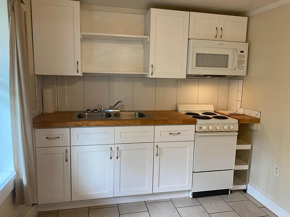 New kitchen wood Shaker cabinets, soft close, butcher block counters, new over-stove microwave