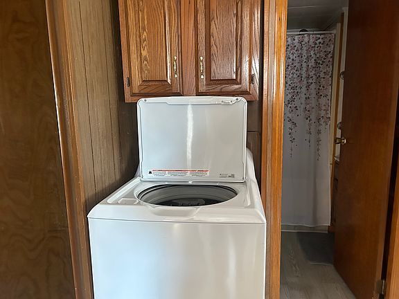 Washer with entrance to bathroom to the right