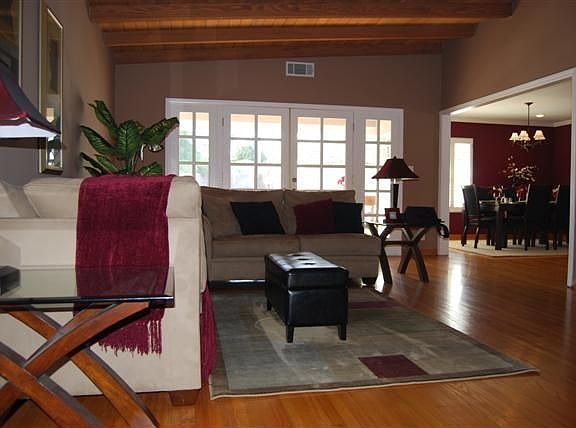 Living room - French doors, cathedral ceilings & hard wood floors