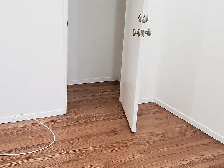 Bedroom closet with door opened.