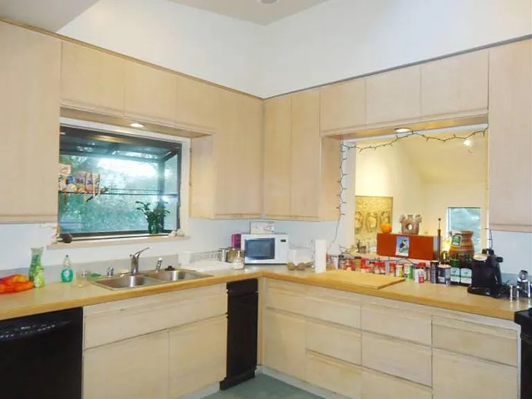 Kitchen and social portal to living room