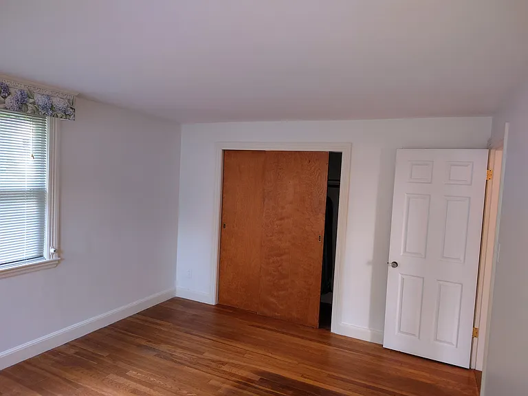 Master bedroom showing closet and door.