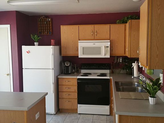 Kitchen includes DW, Stove, microwave, refrigerator and a pa