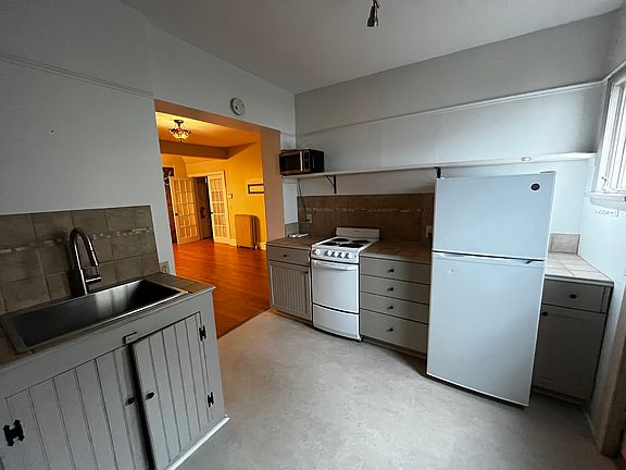 Kitchen, view into living room