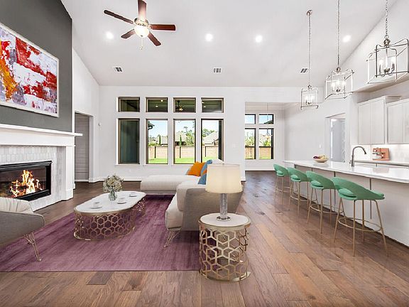 Open great room with views to the back yard, virtually staged for demonstration