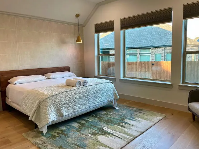Master Bedroom with Backyard View, and 60-inch Smart TV