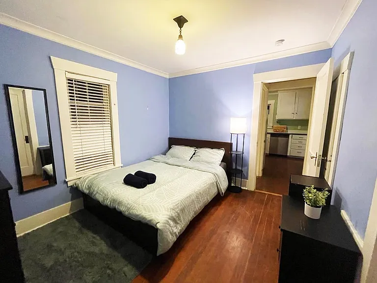 Spacious bedroom #2 with queen size bed & closet. 2 big windows so getting good sunlight during the day (picture taken at night)