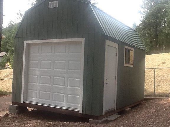 Large custom-built shed in backyard