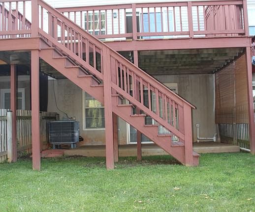 Back of house with two decks