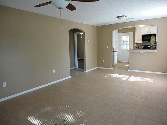 Large, sunny and entertainment size living area you will love and enjoy - features arched doorways a