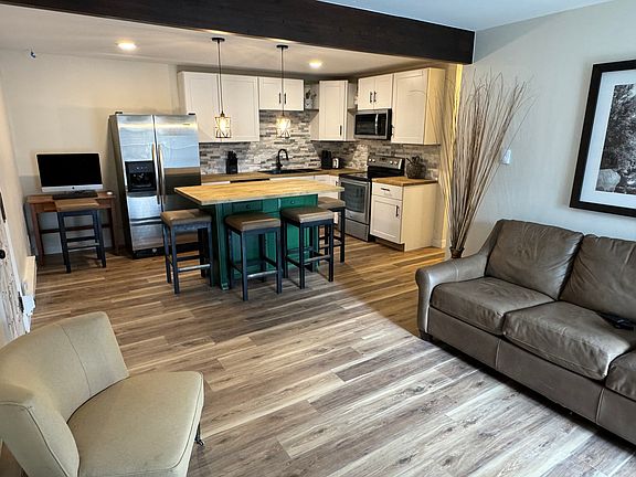 The living room flows into the kitchen