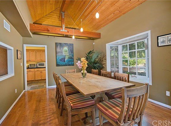 Dining Room with Bay Window, Beamed Ceiling & Cont