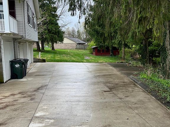 concrete driveway with picnic shelter