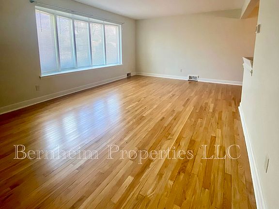 Living Room - Beautiful refinished hardwood floors. Large bay window.