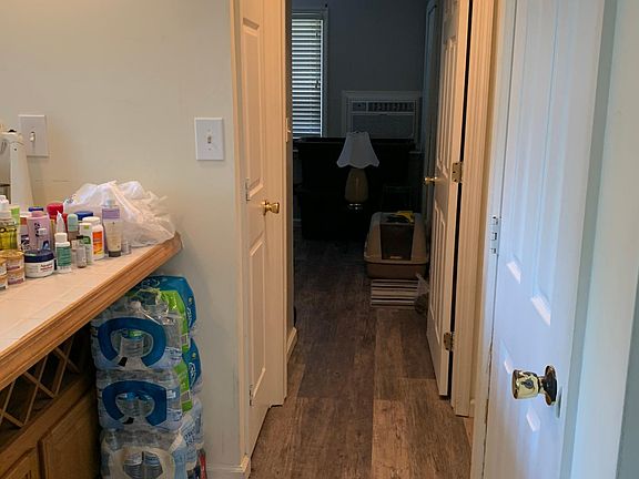 Hallway #1 by kitchen looking into bedroom