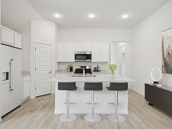 Kitchen in the Cypress home plan by Trophy Signature Homes - REPRESENTATIVE PHOTO