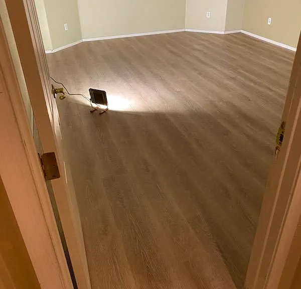 Master bedroom retreat. Brand new L.V.P. -Luxury Vinyl Plank flooring, plantation shutters. Picture taken at night on November 13, 2023 standing at bedroom door.