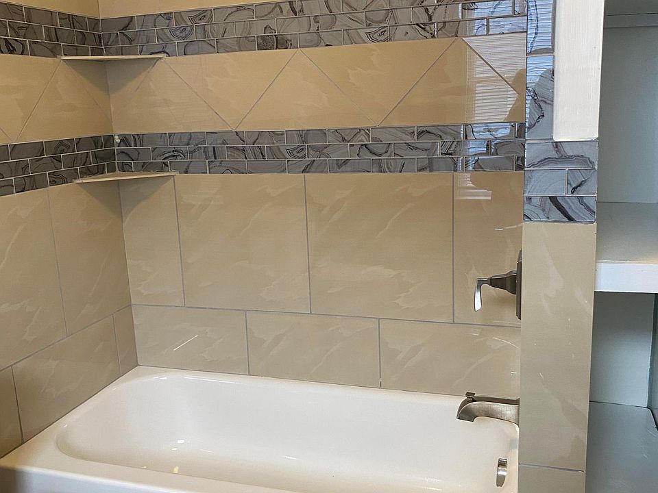 Tub, shower and built in shelves