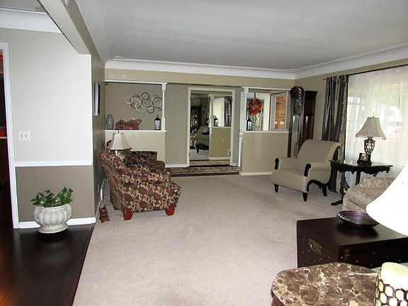Living Room: Beautiful colors throughout this home and brand new flooring in entry!