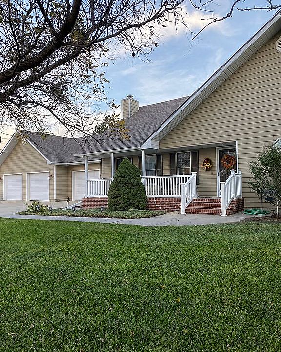 Covered porch 3 car garage