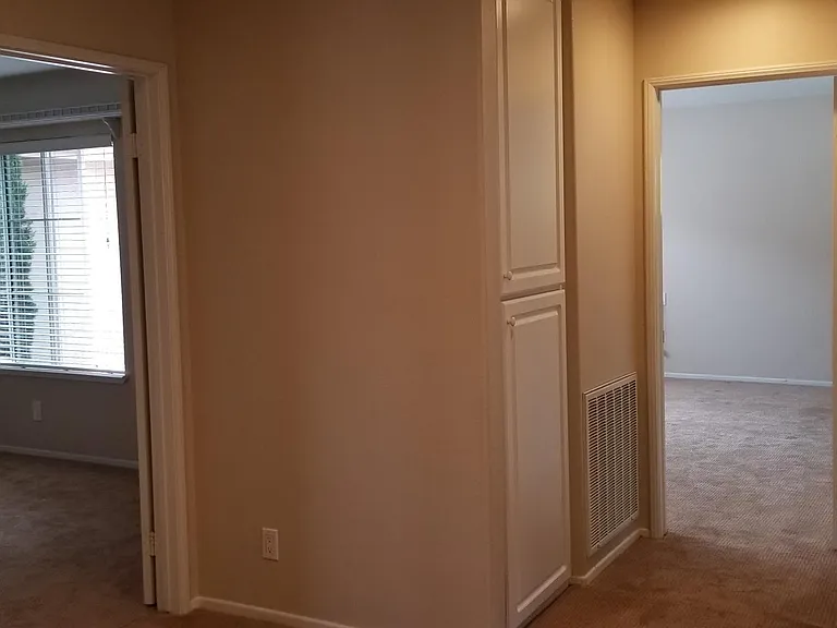 View into Bedroom #2 (left) and Master Bedroom (right) from top of stairs