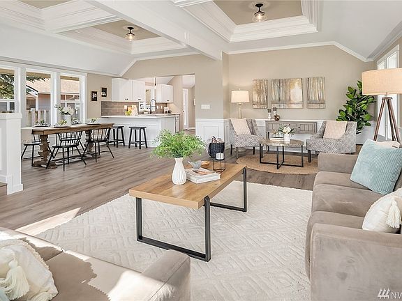 Open floor plan with dining area and kitchen in view