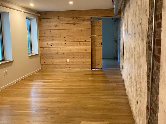 living space looking west at rear bedroom