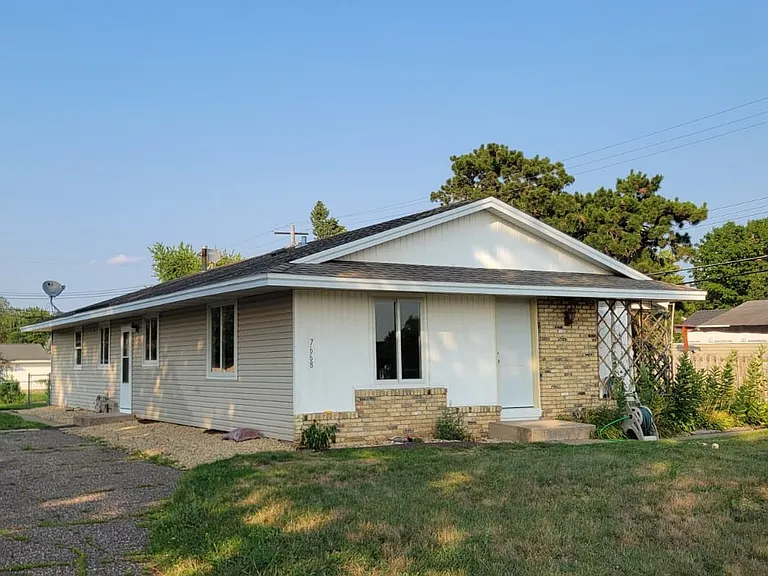 Exterior of duplex home. The left unit newly remodeled 8/26 and is available now.