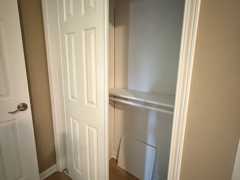Primary bedroom bathroom area with second closet.
