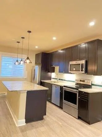 Full Kitchen with stainless steel appliances.