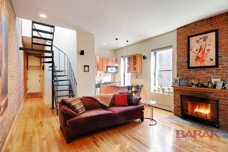 Living Room w/ wood burning fireplace