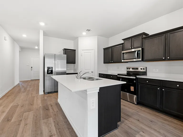 Kitchen including fridge