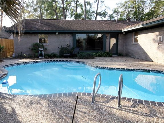 Outdoor pool is a rare find in Timbergrove Manor. 