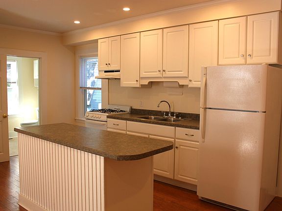 Kitchen with double stainless steel sink and gas range