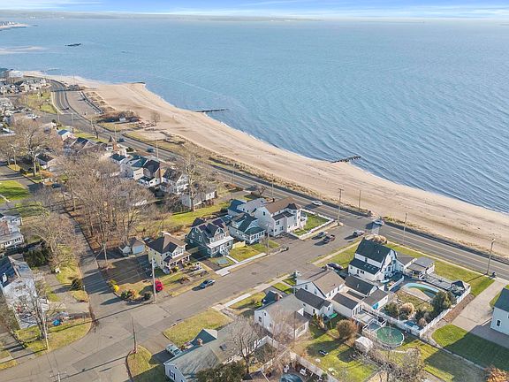 Third house from sandy beach.