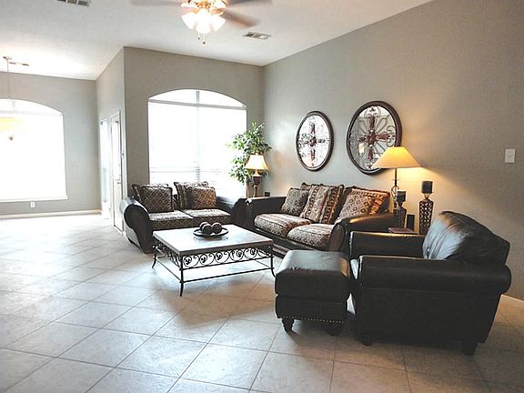 Architectural details, gas fireplace, palladian windows, gorgeous tile flooring, art niches...and it's family sized!