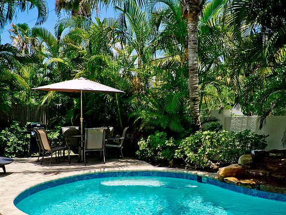 Heated pool with waterfall
