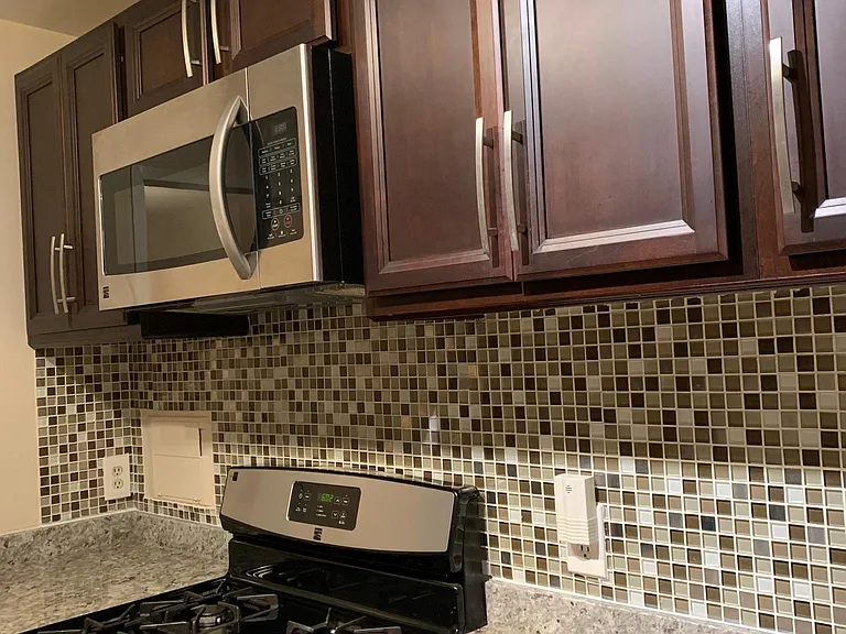 Kitchen with granite and stainless steel appliances