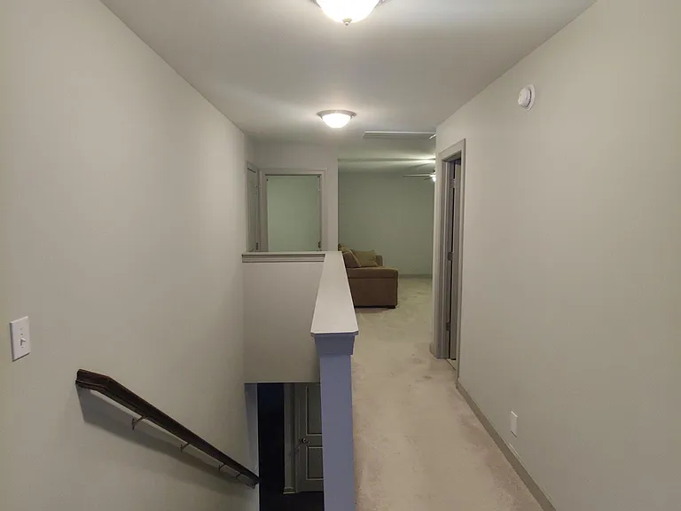 Hall looking at game room, room 2 and linen closet